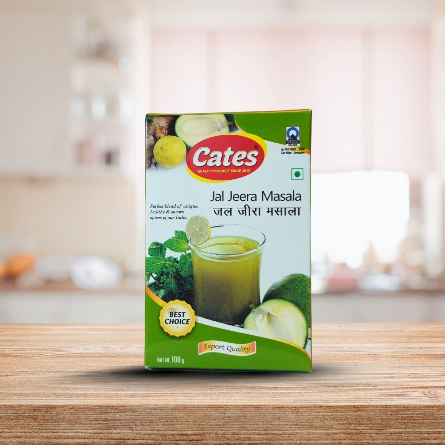 Cates Jal Jeera Masala packaging on a wooden surface with a blurred kitchen background